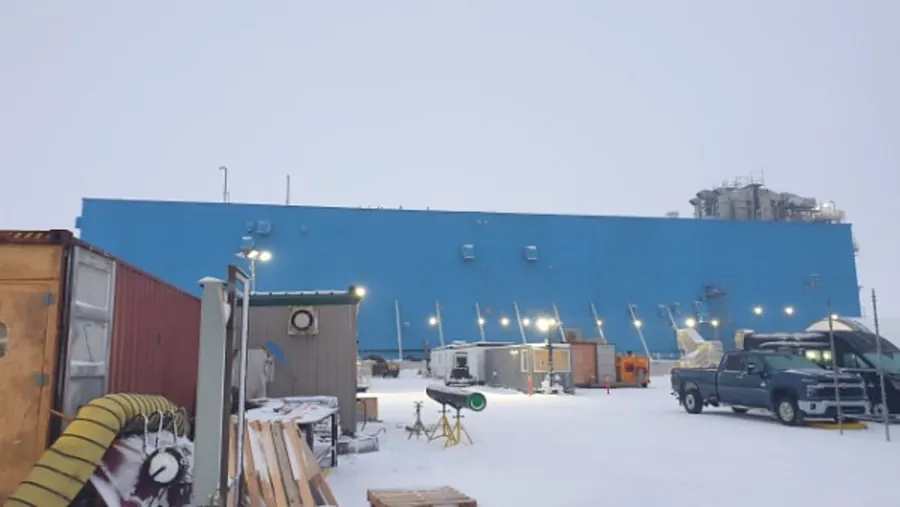 Facility in the snow with work trucks