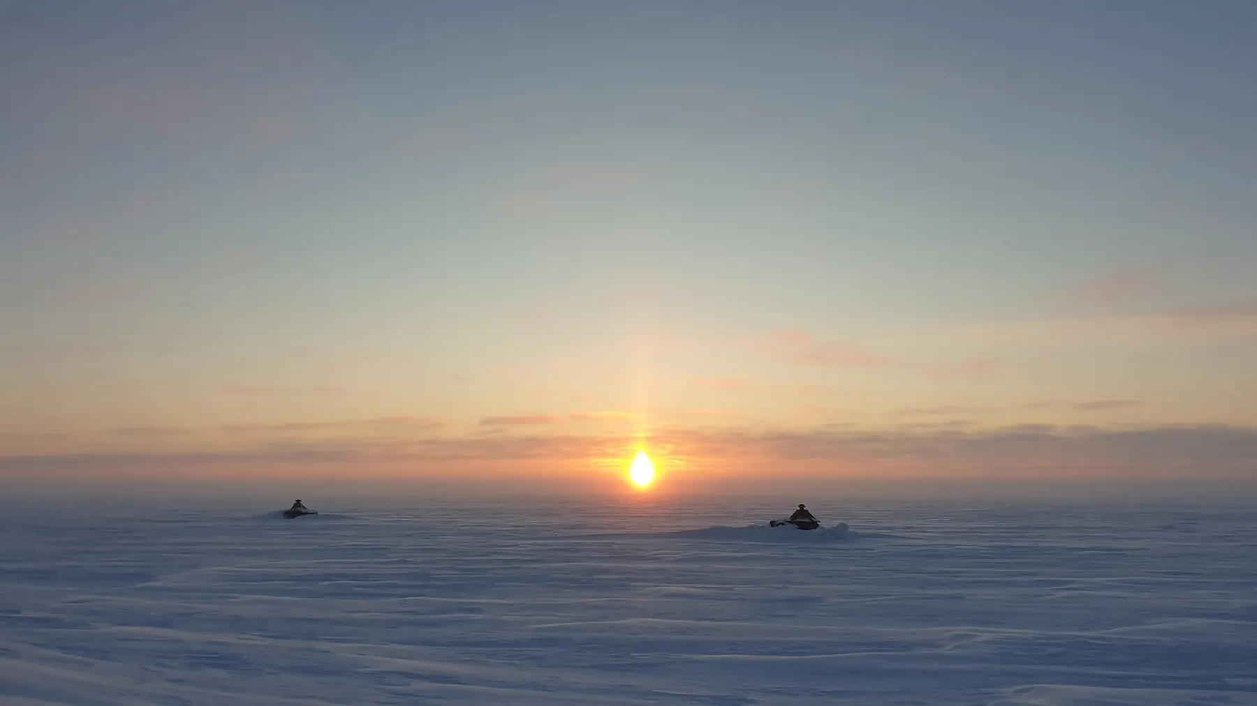 Sun setting over the frozen North Slope of Alaska