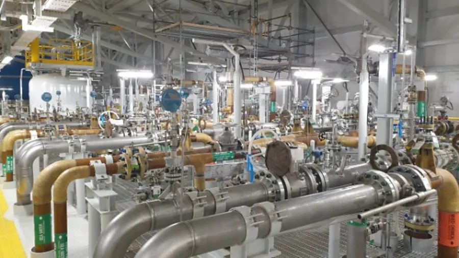 Coated and stainless piping manifold inside a facility